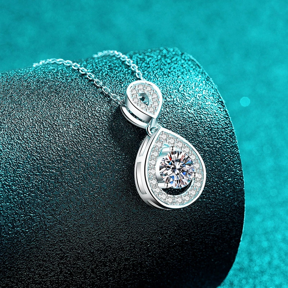 Teardrop Halo Moissanite Pendant Necklace with CZ in Rhodium-Plated S925 sterling silver blue display scene showing chain and stone layout