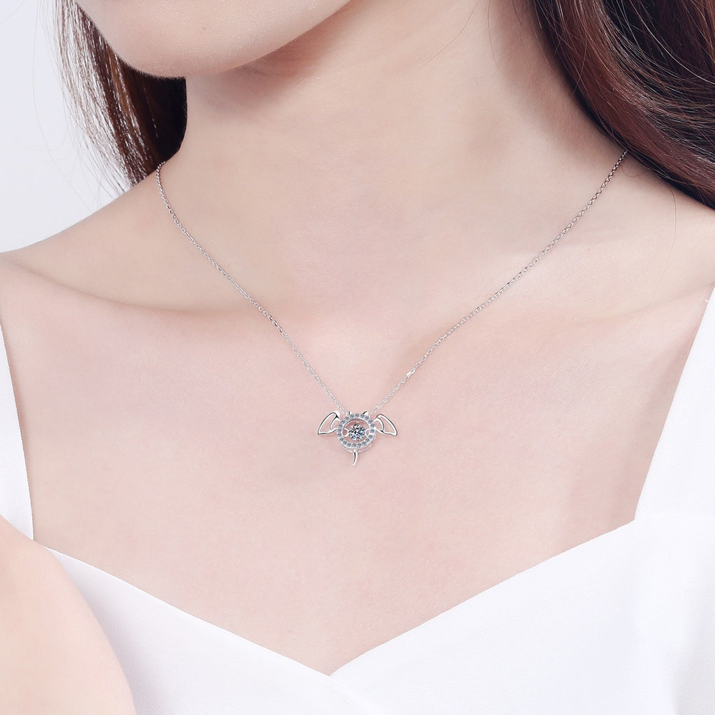 Devil Wing Moissanite Pendant Necklace with CZ in Rhodium-Plated S925 sterling silver worn on neckline by model showing scale and adjustable chain styling