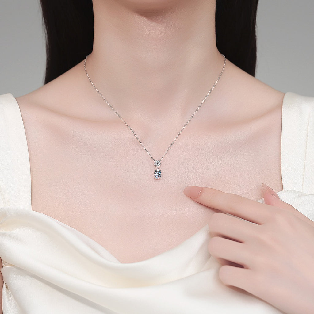 Bow Oval Moissanite Pendant Necklace in Rhodium-Plated S925 sterling silver neckline model view showing pendant scale and adjustable chain