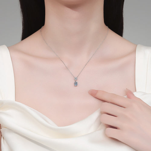 Bow Oval Moissanite Pendant Necklace in Rhodium-Plated S925 sterling silver neckline model view showing pendant scale and adjustable chain