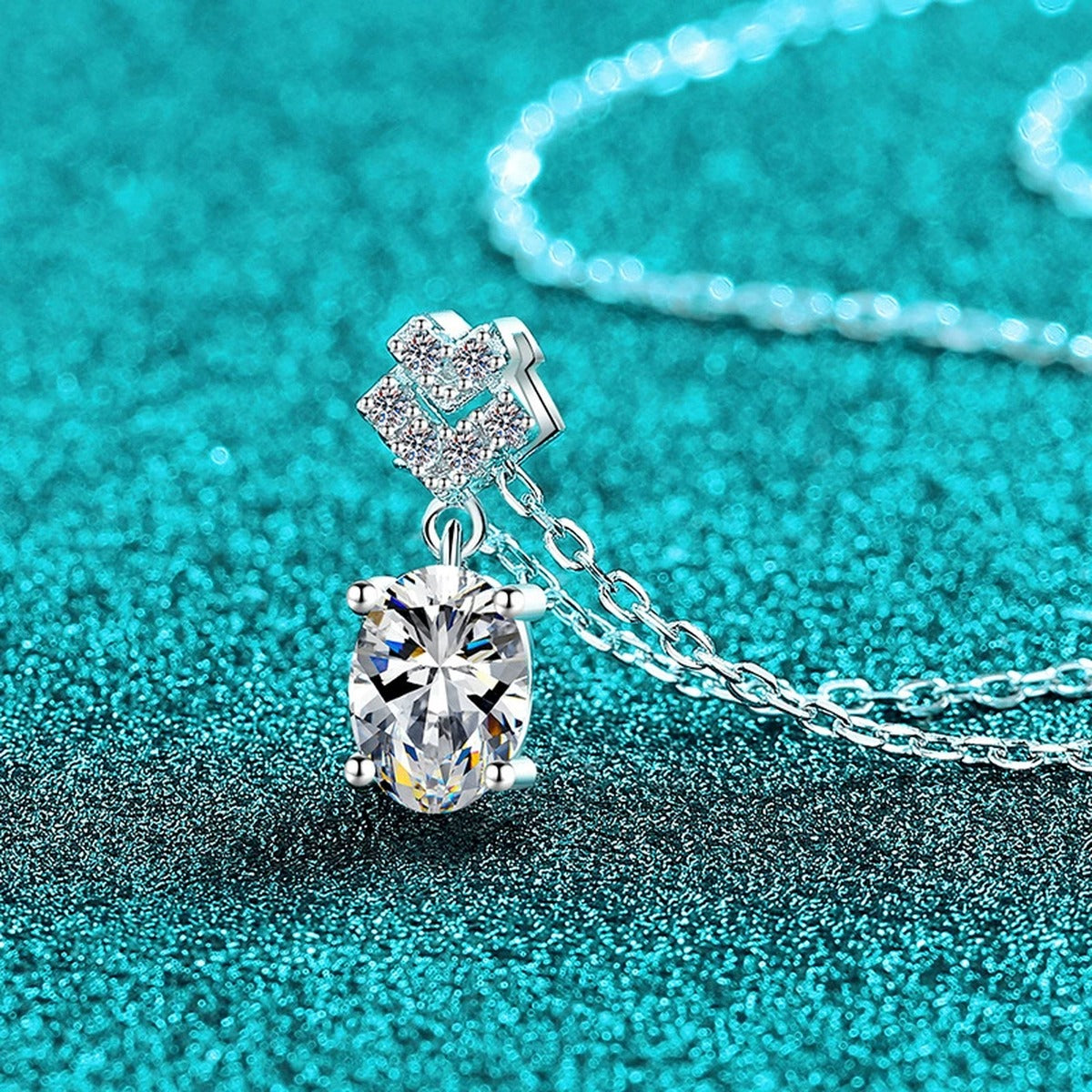Bow Oval Moissanite Pendant Necklace in Rhodium-Plated S925 sterling silver close-up product scene showing pendant setting