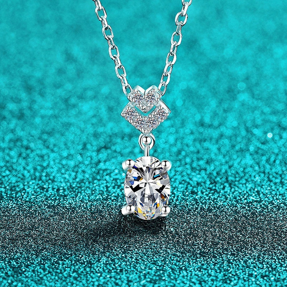 Bow Oval Moissanite Pendant Necklace in Rhodium-Plated S925 sterling silver blue display scene showing chain and stone layout