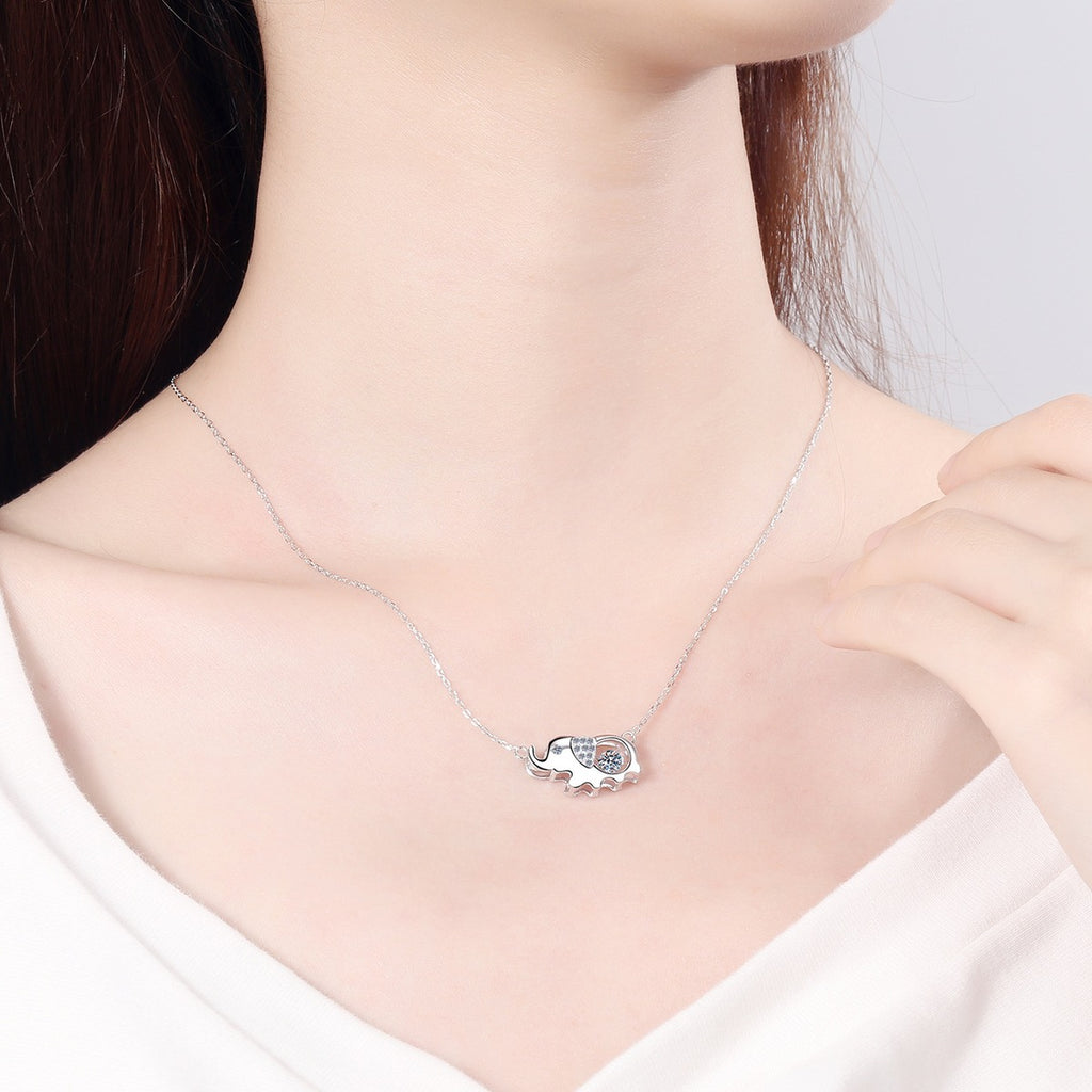 Elephant Moissanite Pendant Necklace with CZ in Rhodium-Plated S925 sterling silver worn on neckline by model showing scale and adjustable chain styling