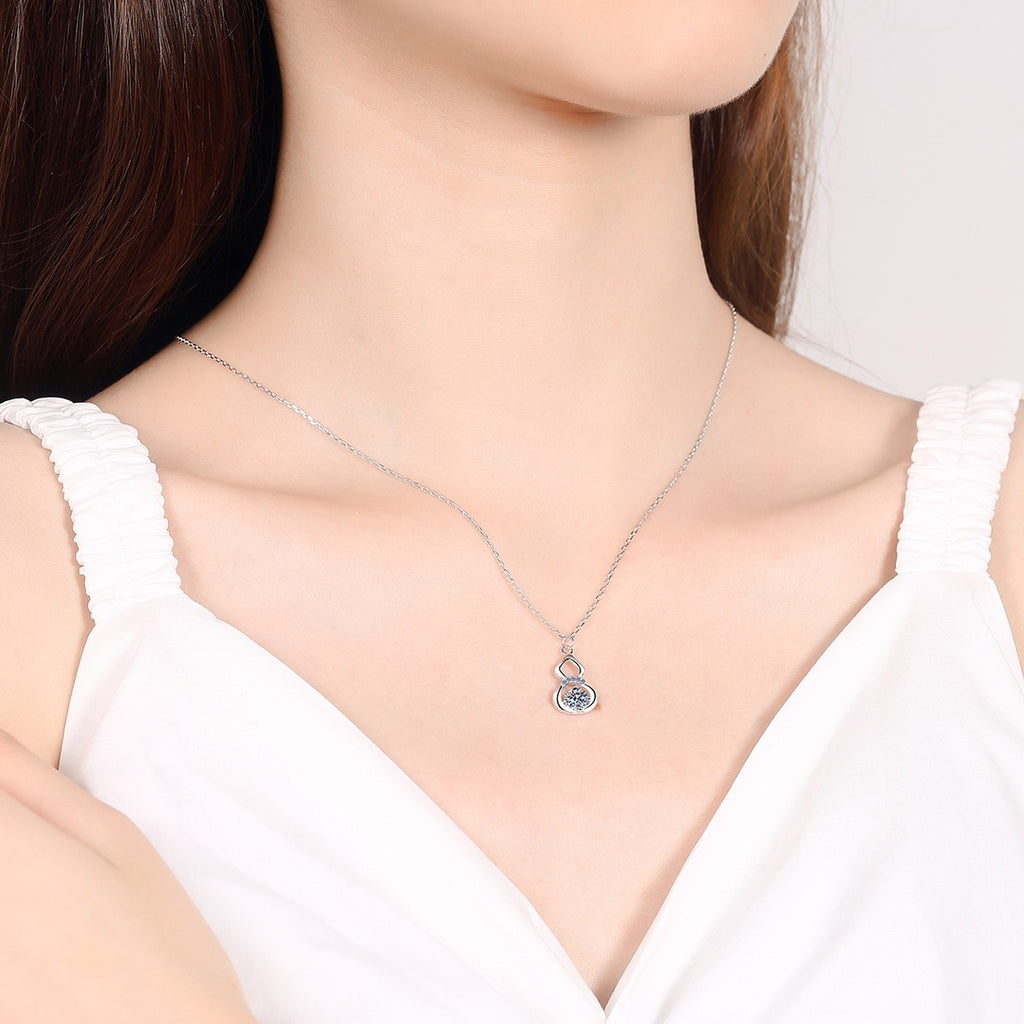 Gourd Moissanite Pendant Necklace with CZ in Rhodium-Plated S925 sterling silver worn on neckline by model showing scale and adjustable chain styling