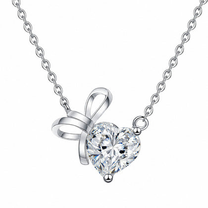 Bow Heart Moissanite Pendant Necklace in Rhodium-Plated S925 sterling silver white background product photo showing heart cut moissanite pendant with a small bow accent