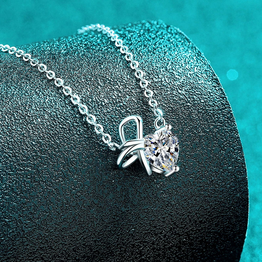 Bow Heart Moissanite Pendant Necklace in Rhodium-Plated S925 sterling silver close-up product scene showing pendant setting