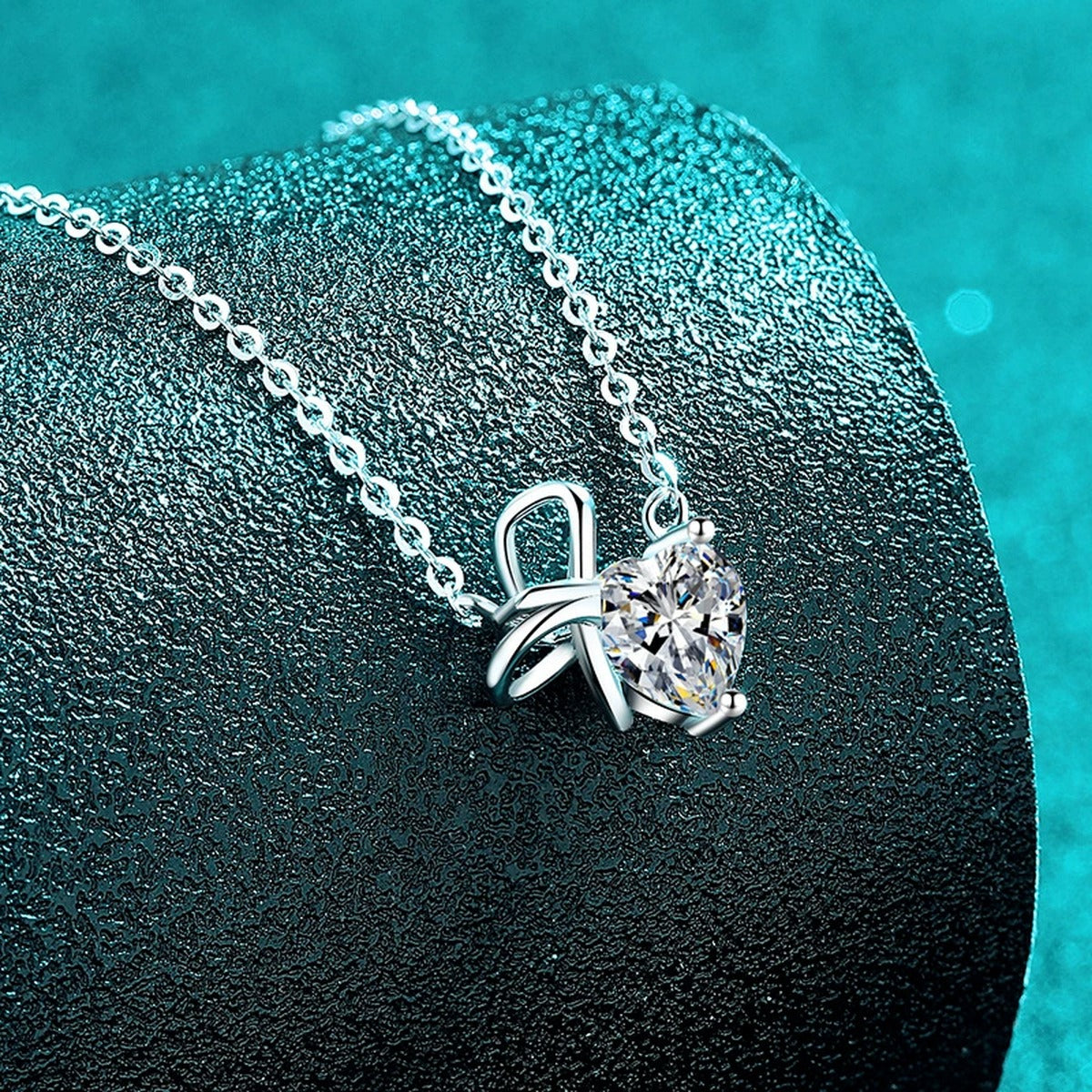 Bow Heart Moissanite Pendant Necklace in Rhodium-Plated S925 sterling silver close-up product scene showing pendant setting