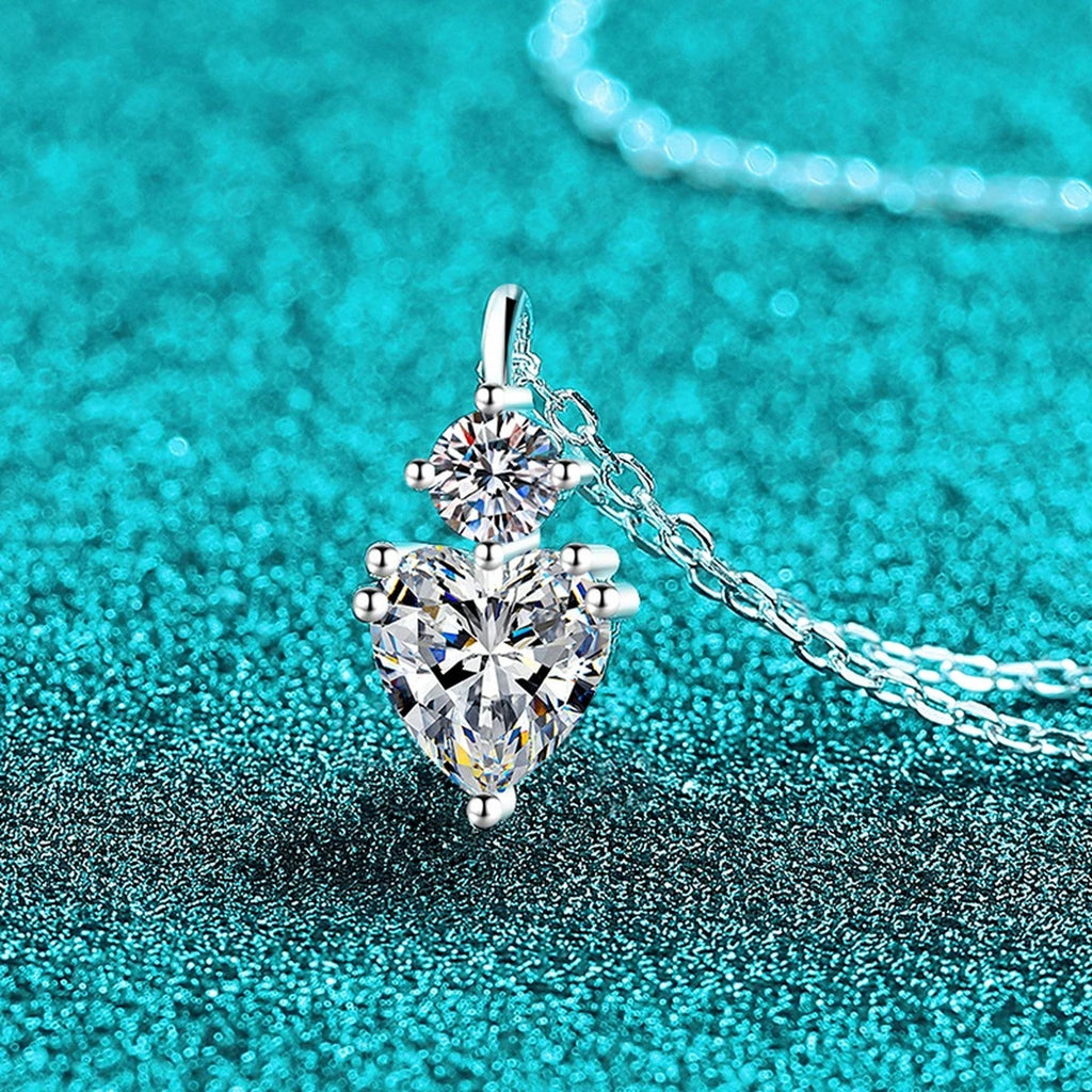Bow Heart and Round Moissanite Pendant Necklace in Rhodium-Plated S925 sterling silver close-up product scene showing pendant setting