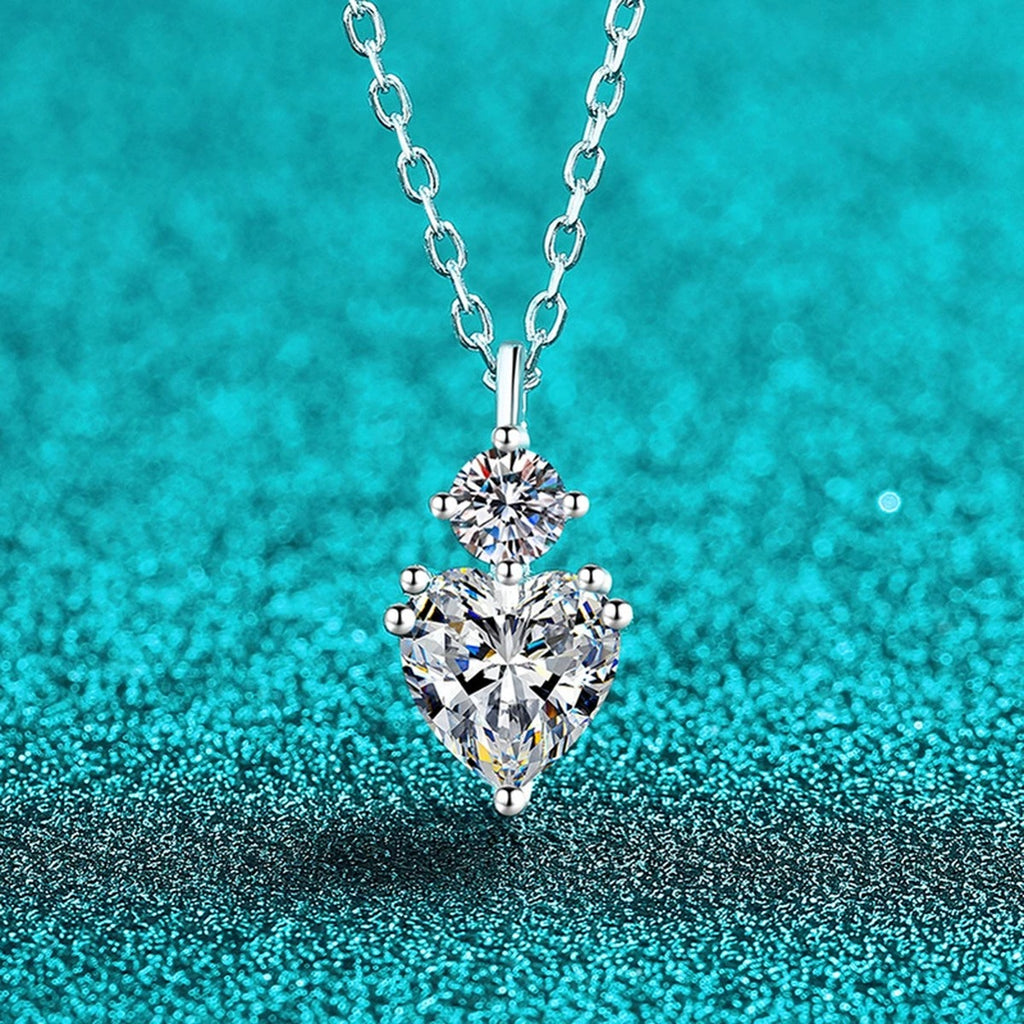 Bow Heart and Round Moissanite Pendant Necklace in Rhodium-Plated S925 sterling silver blue display scene showing chain and stone layout