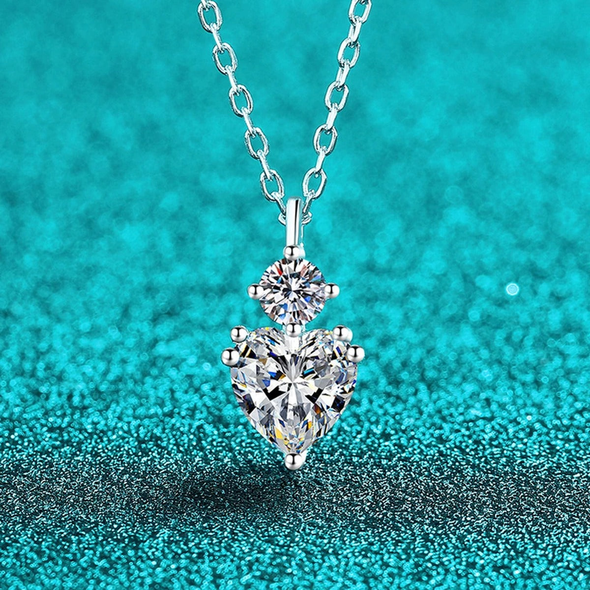Bow Heart and Round Moissanite Pendant Necklace in Rhodium-Plated S925 sterling silver blue display scene showing chain and stone layout