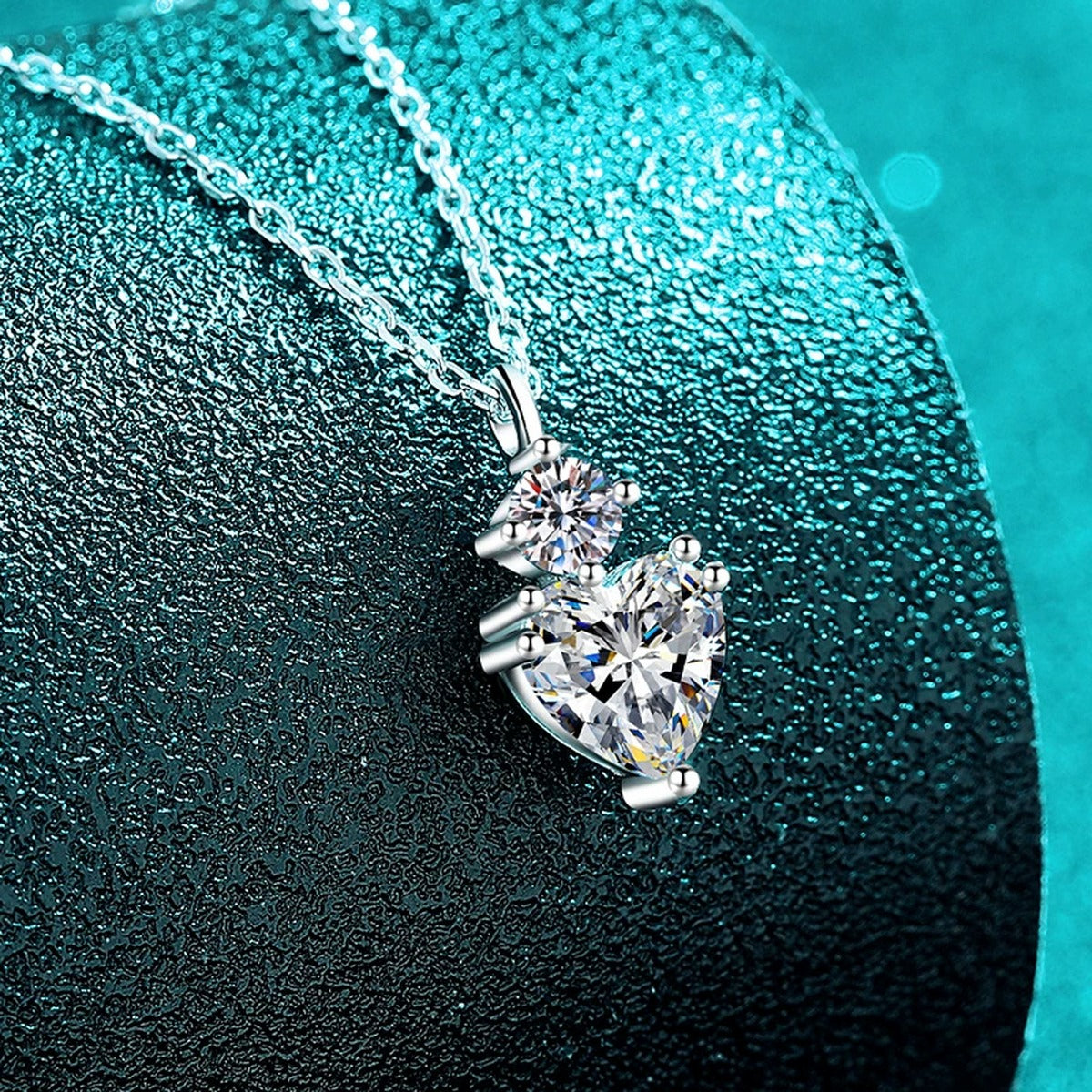 Bow Heart and Round Moissanite Pendant Necklace in Rhodium-Plated S925 sterling silver angled product detail view