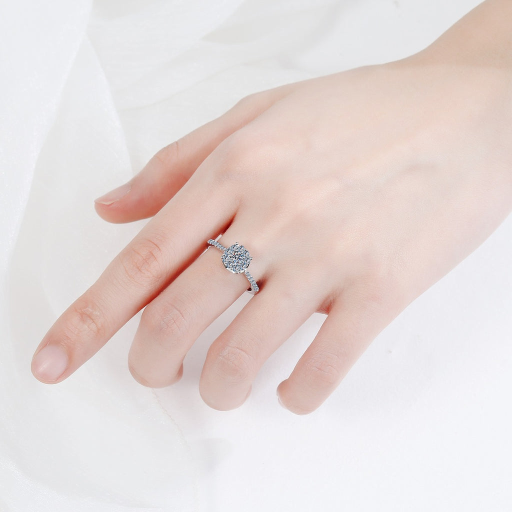 Round Cluster Halo Moissanite Engagement Ring with CZ worn on hand to show scale, band width, and ring profile