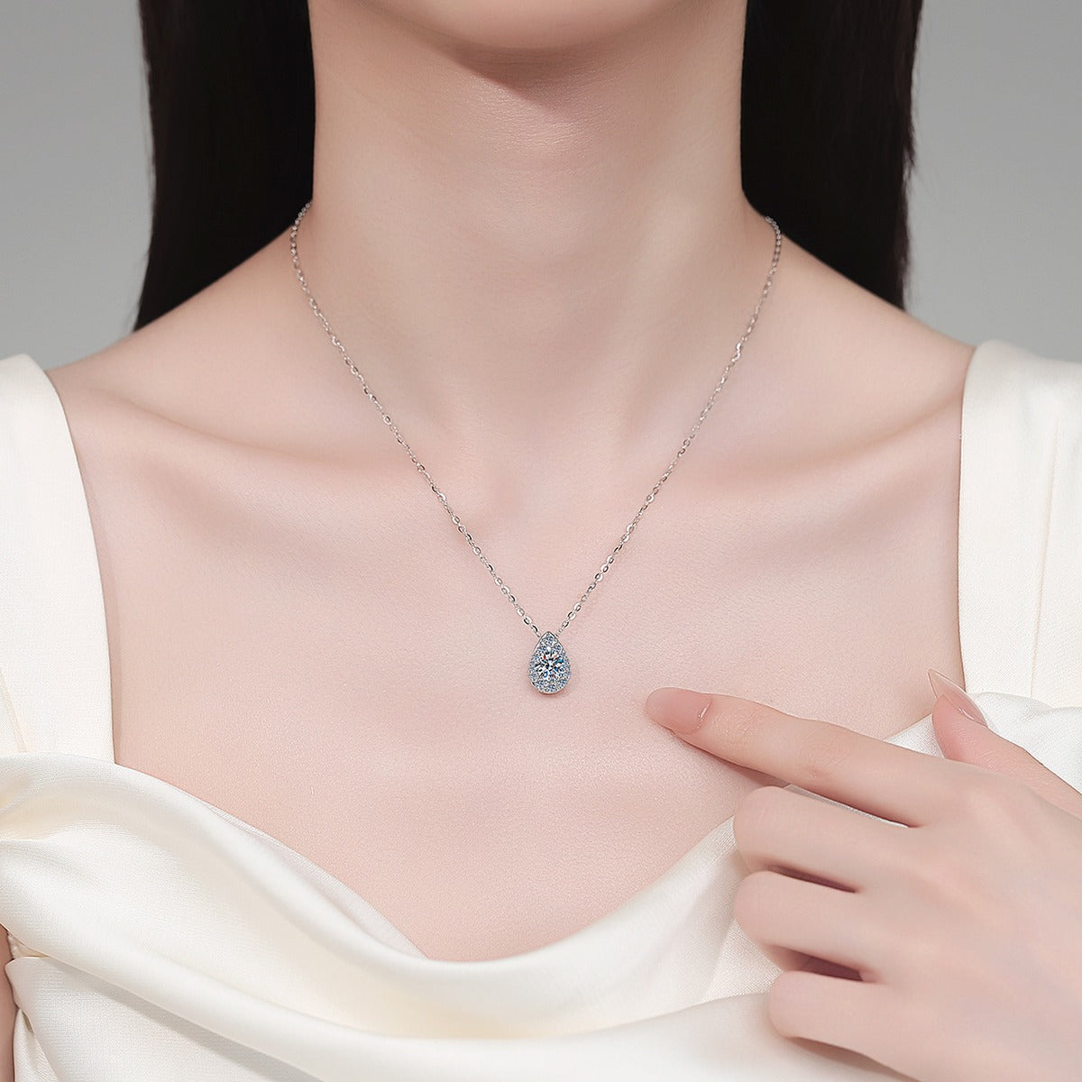Teardrop Halo Moissanite Pendant Necklace with CZ in Rhodium-Plated S925 sterling silver neckline model view showing pendant scale and adjustable chain