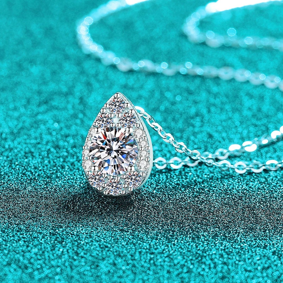 Teardrop Halo Moissanite Pendant Necklace with CZ in Rhodium-Plated S925 sterling silver close-up product scene showing pendant setting