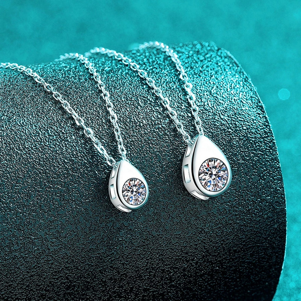 Teardrop Round Moissanite Pendant Necklace in Rhodium-Plated S925 sterling silver blue display scene showing chain and stone layout