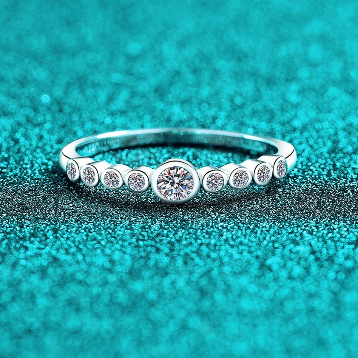 Round Moissanite Stackable Band Ring product view showing moissanite setting and metal finish