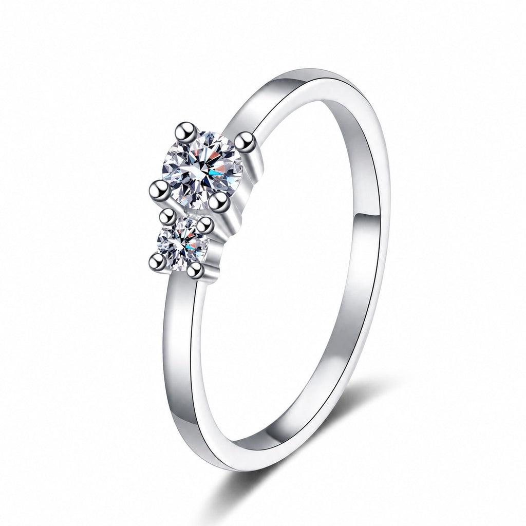 Round Moissanite Three Stone Ring in rhodium-plated S925 sterling silver on clean white background