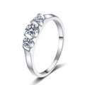 Round Moissanite Five Stone Ring in rhodium-plated S925 sterling silver on clean white background