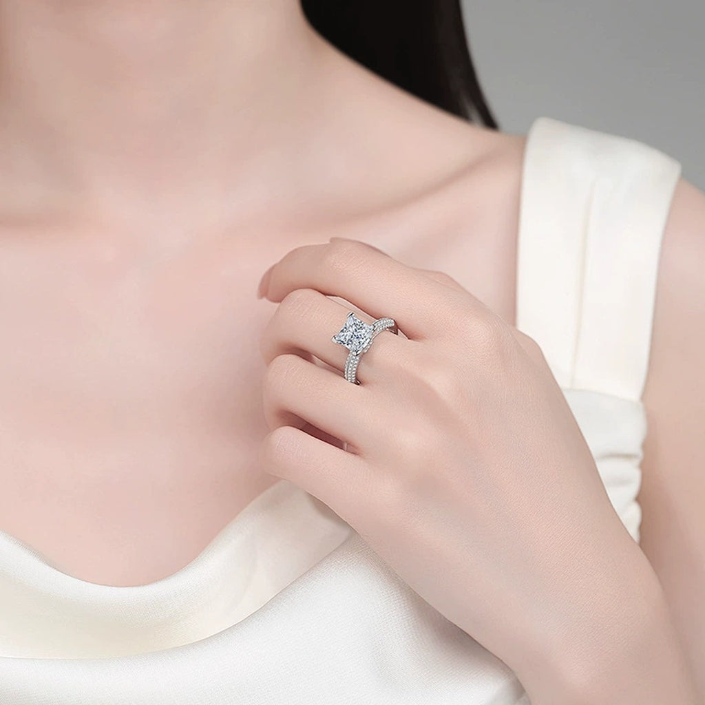 Princess Cut Moissanite Ring with CZ worn on hand to show scale, band width, and ring profile