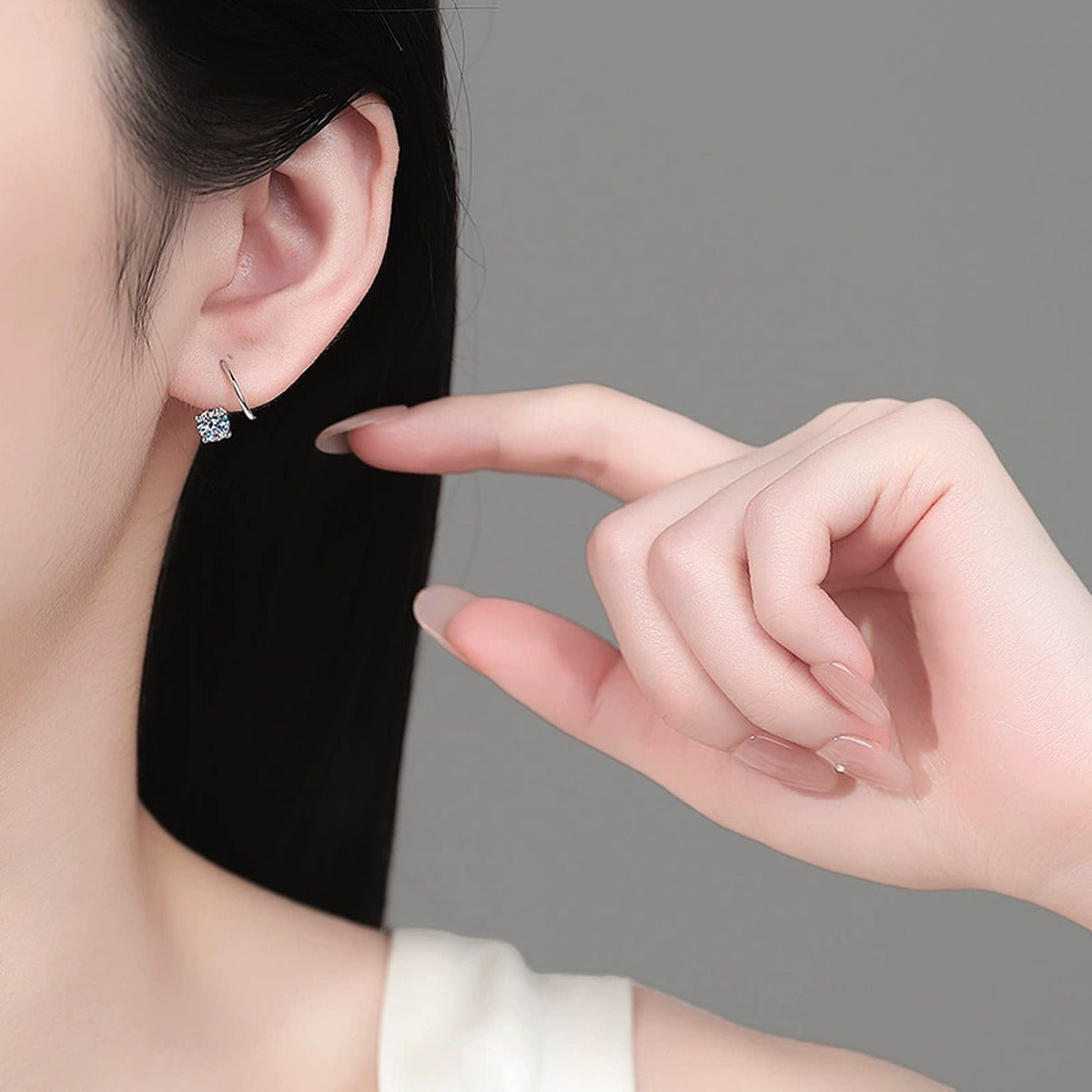 Round Moissanite Hook Ear Cuff Earrings in Rhodium-Plated S925 sterling silver worn on ear by model showing scale, placement, and hook ear cuff earrings styling