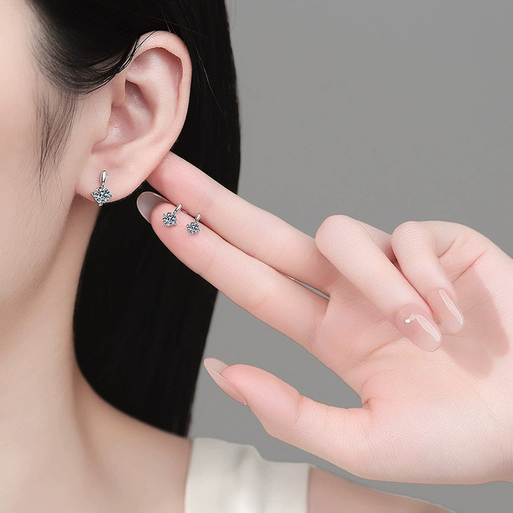 Round Moissanite Stud Drop Earrings in Rhodium-Plated S925 sterling silver worn on ear by model showing scale, placement, and stud earrings styling