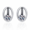 Round Moissanite Oval Stud Earrings in Rhodium-Plated S925 sterling silver white background product photo showing the pair, stone shape, and stud earrings silhouette