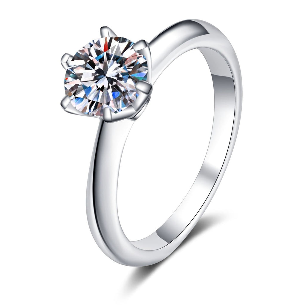 Round Moissanite Solitaire Ring in Rhodium-Plated S925 Sterling Silver clean white background product photo showing the ring silhouette and moissanite setting