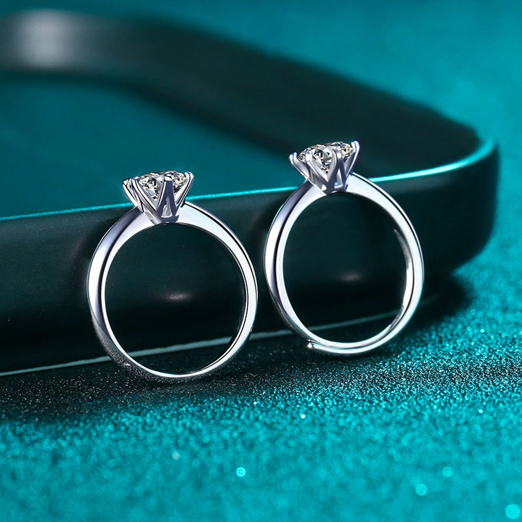 Round Moissanite Solitaire Ring in Rhodium-Plated S925 Sterling Silver blue display product photo showing the moissanite setting and band profile