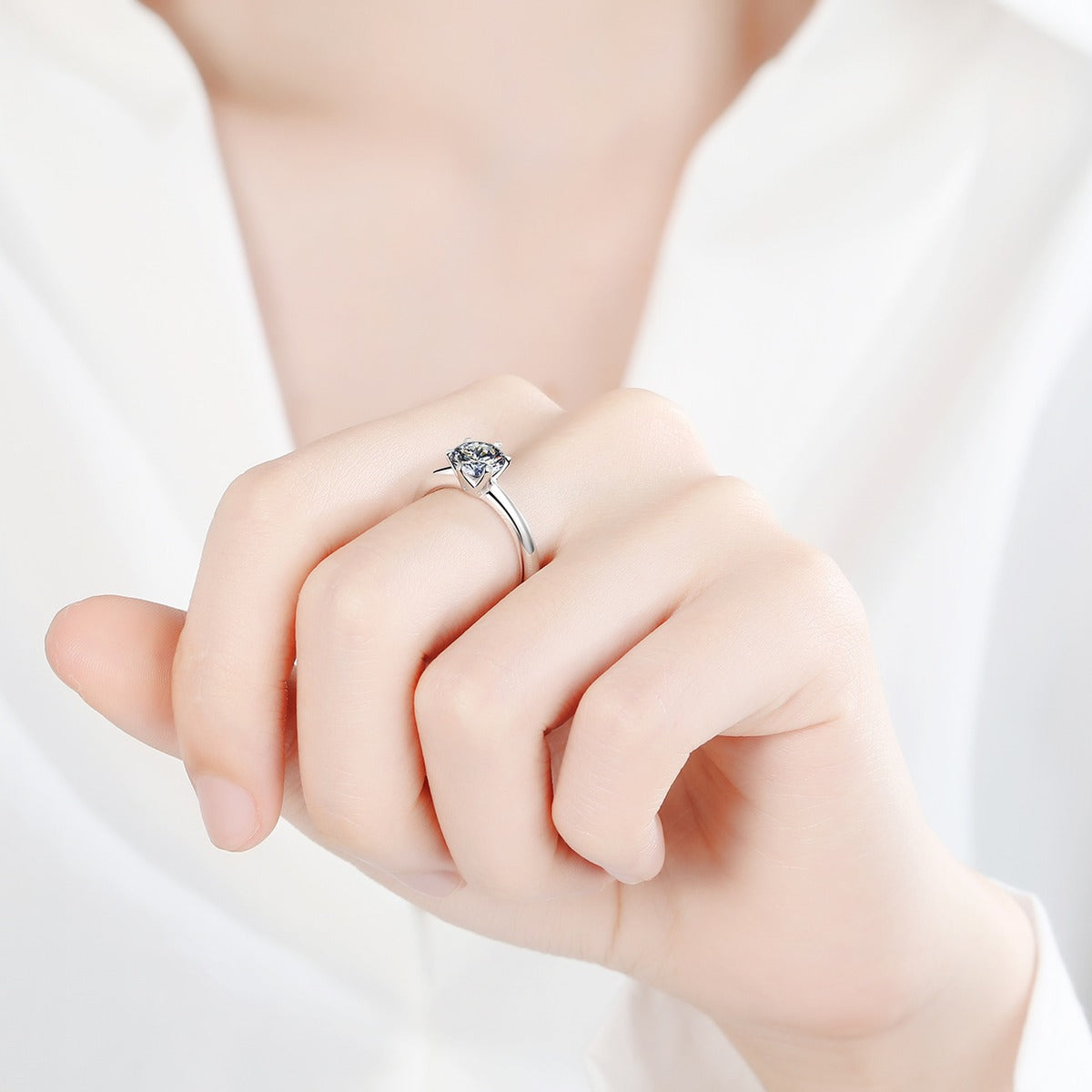 Round Moissanite Solitaire Ring in Rhodium-Plated S925 Sterling Silver studio product angle showing the ring setting, stone detail, and band design