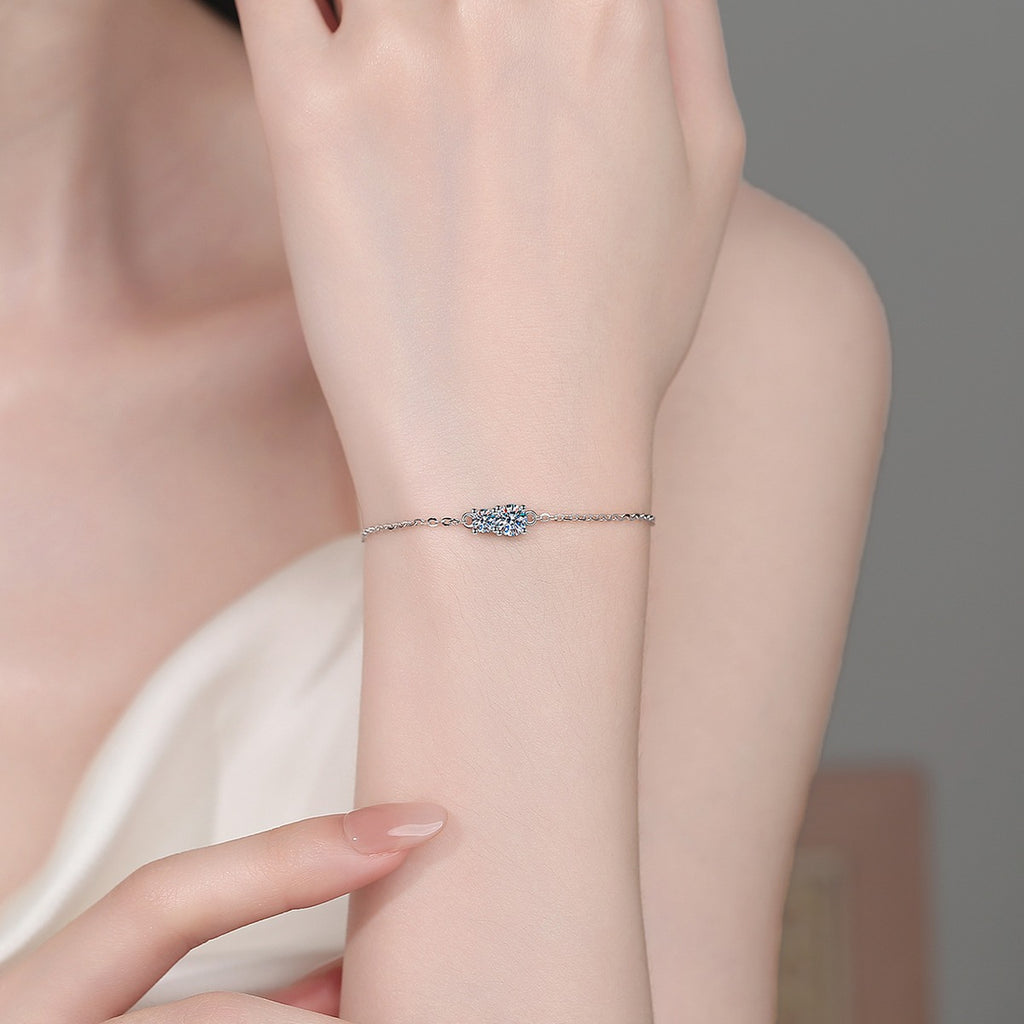 Round Moissanite Adjustable Chain Bracelet in Rhodium-Plated S925 sterling silver worn on wrist model view showing scale and adjustable fit