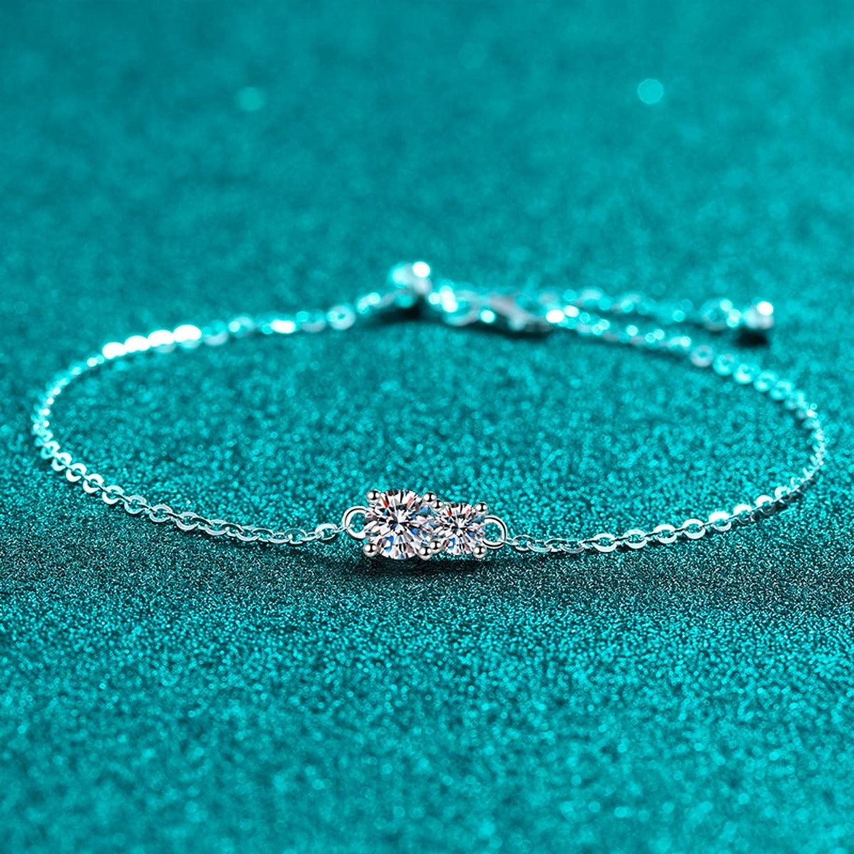 Round Moissanite Adjustable Chain Bracelet in Rhodium-Plated S925 sterling silver angled product display showing bracelet silhouette