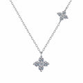 Two-Tone Clover Round Moissanite Necklace in Gold-Plated S925 sterling silver white background product photo showing clover pendant offered in rhodium and champion gold plating with round moissanite