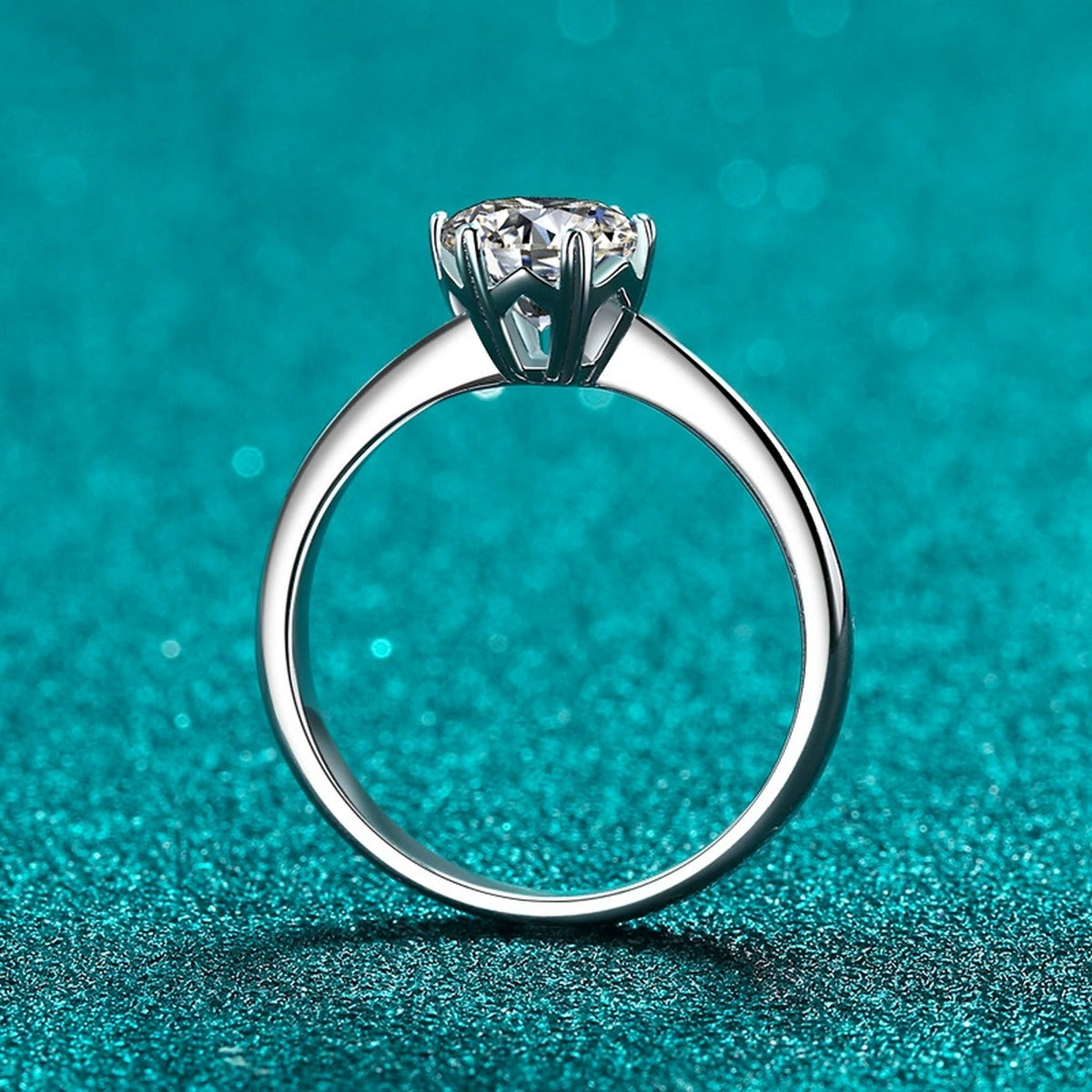 Round Moissanite Solitaire Engagement Ring product view showing moissanite setting and metal finish