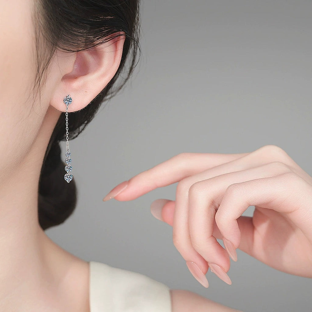 Graduated Moissanite Chain Stud Dangle Earrings in Rhodium-Plated S925 sterling silver worn on ear by model showing scale, placement, and stud dangle earrings styling