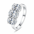 Oval Moissanite Three Stone Ring in rhodium-plated S925 sterling silver on clean white background