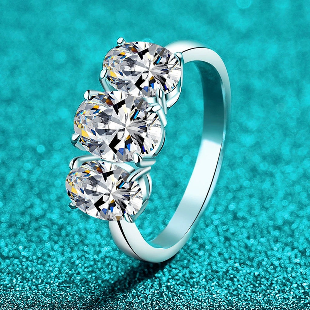 Oval Moissanite Three Stone Ring product view showing moissanite setting and metal finish