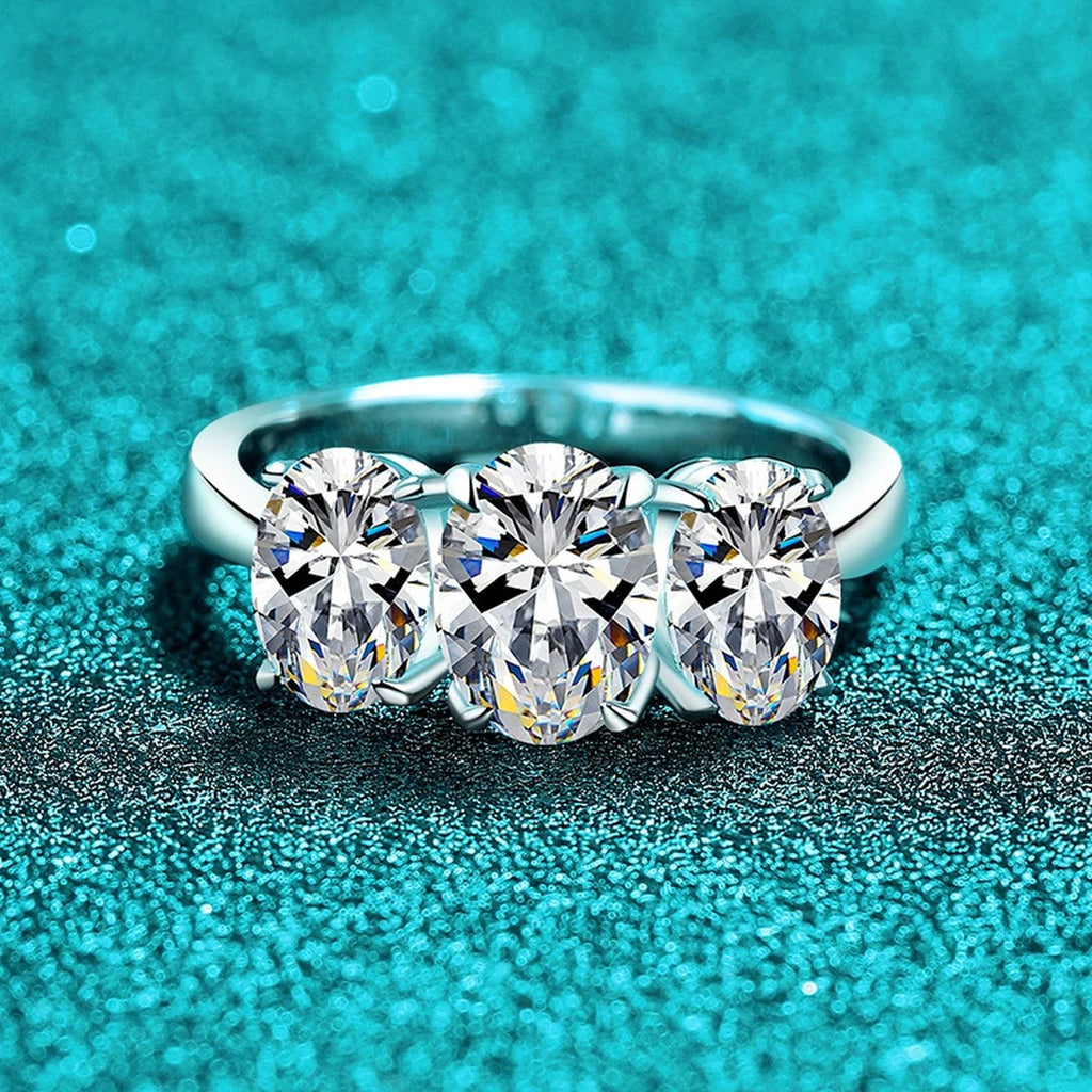 Oval Moissanite Three Stone Ring product view showing moissanite setting and metal finish