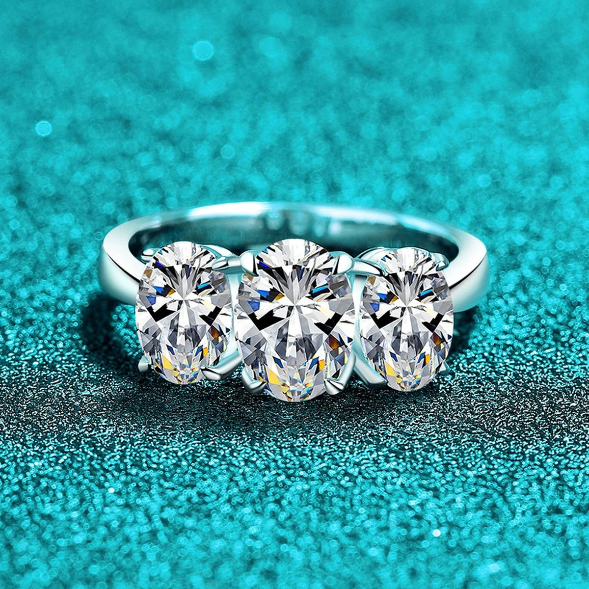 Oval Moissanite Three Stone Ring product view showing moissanite setting and metal finish