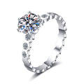 Round Moissanite Side Stone Ring with CZ in rhodium-plated S925 sterling silver on clean white background