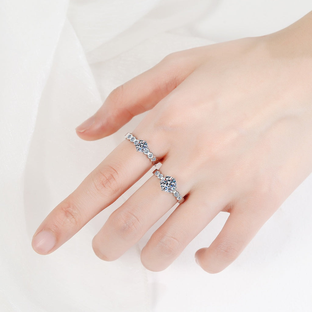 Round Moissanite Side Stone Ring with CZ worn on hand to show scale, band width, and ring profile