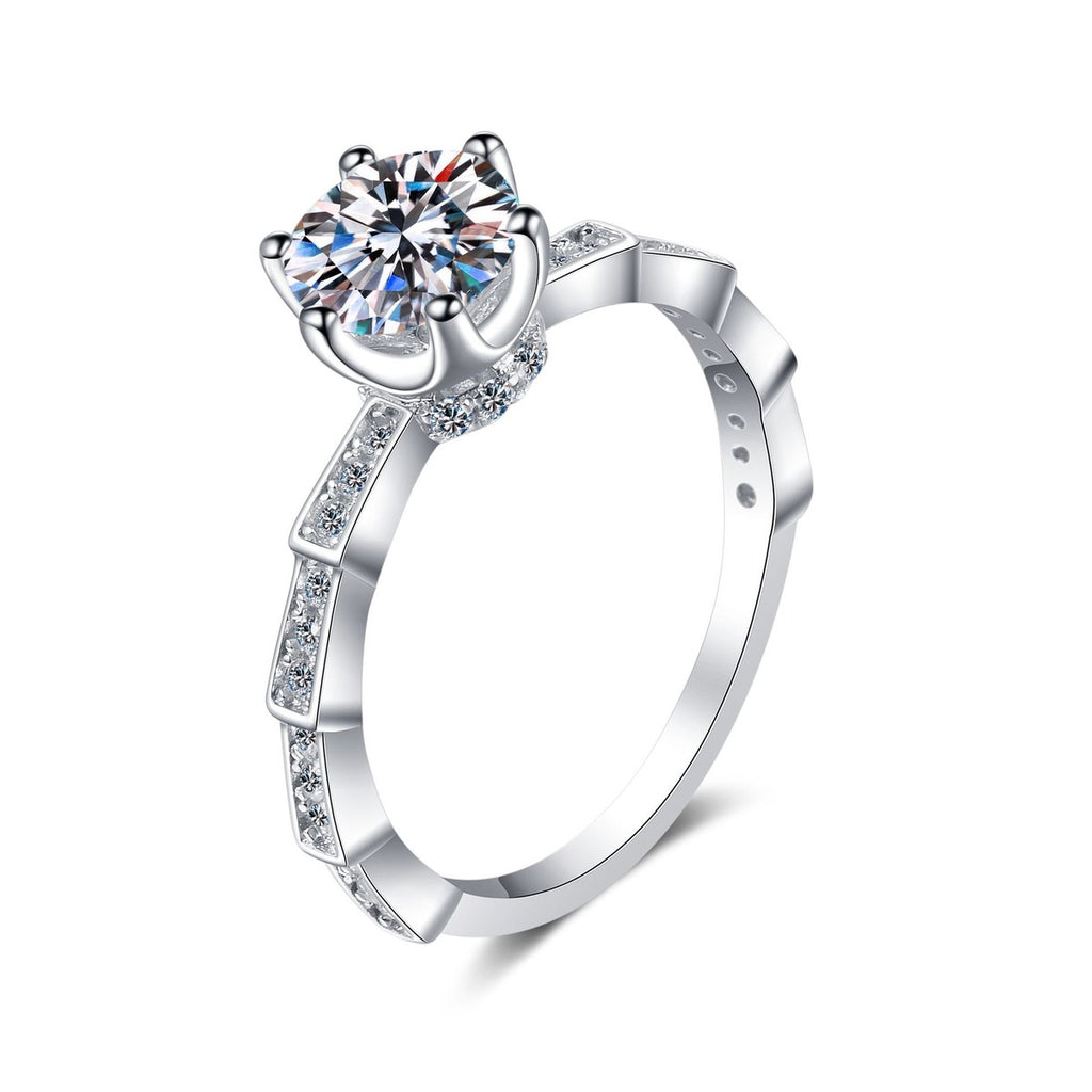 Round Moissanite Side Stone Ring with CZ in rhodium-plated S925 sterling silver on clean white background