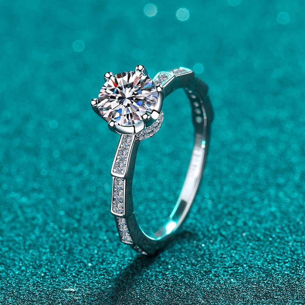 Round Moissanite Side Stone Ring with CZ product view showing moissanite setting and metal finish