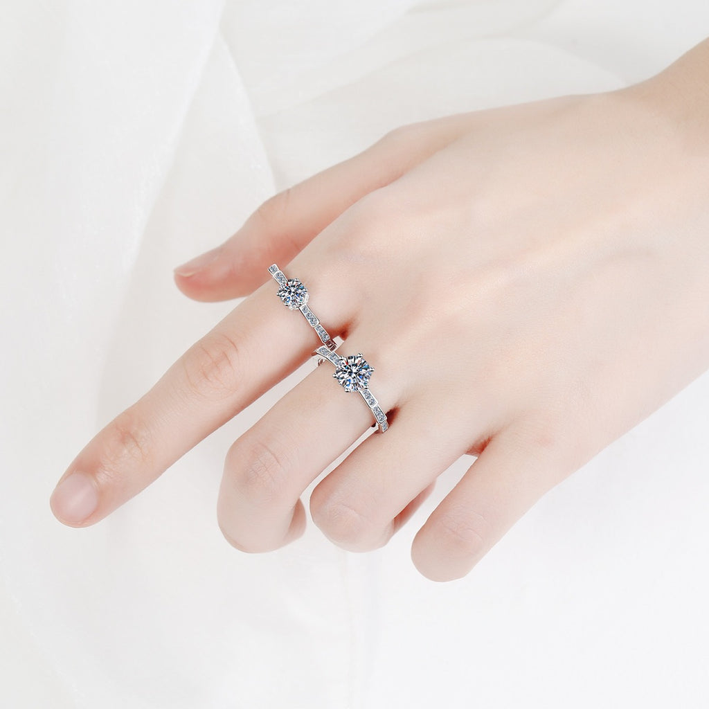 Round Moissanite Side Stone Ring with CZ worn on hand to show scale, band width, and ring profile