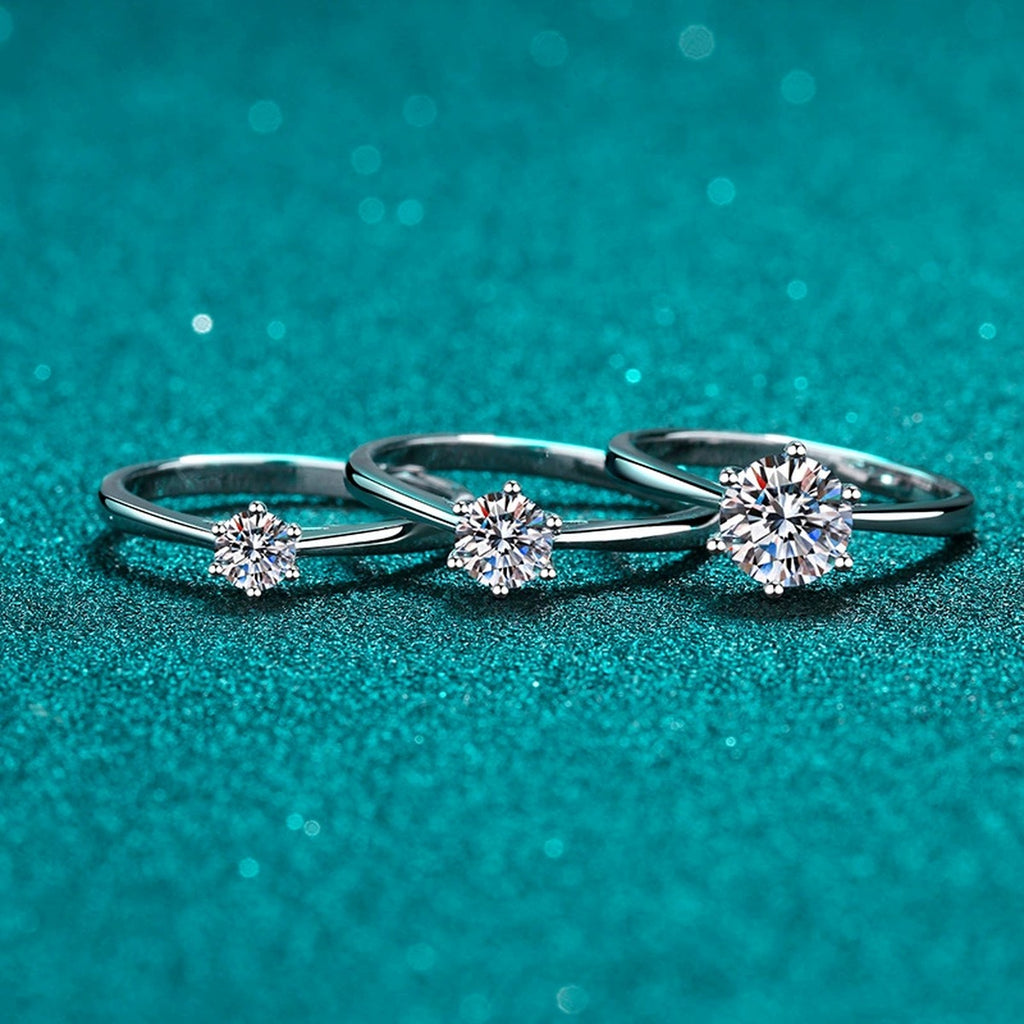 Round Moissanite Solitaire Ring in Rhodium-Plated S925 Sterling Silver blue display product photo showing the moissanite setting and band profile