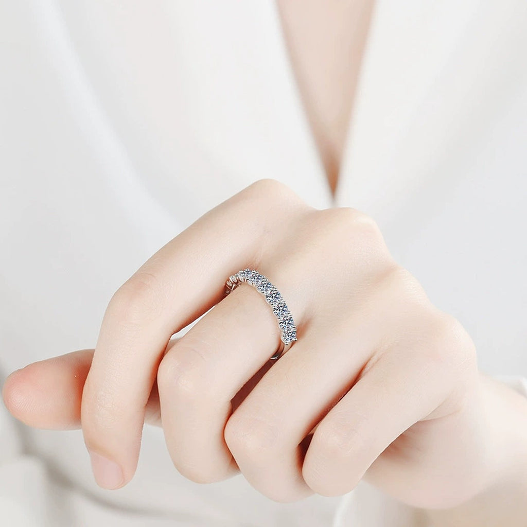 Pave Moissanite Band Ring in Rhodium-Plated S925 Sterling Silver worn on hand, showing scale, finger coverage, and rhodium-plated finish