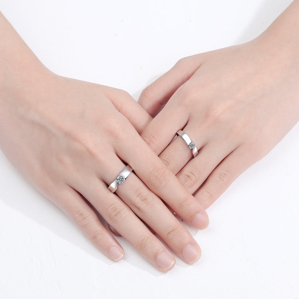 Round Moissanite Couples Ring Set worn on hand to show scale, band width, and ring profile