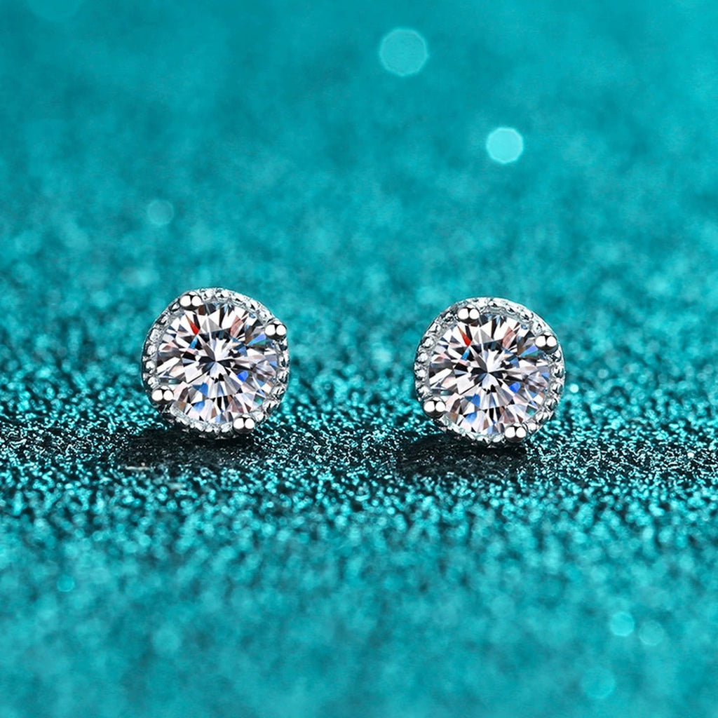 Round Moissanite Stud Earrings in Rhodium-Plated S925 Sterling Silver blue textured product scene showing the front sparkle of the pair