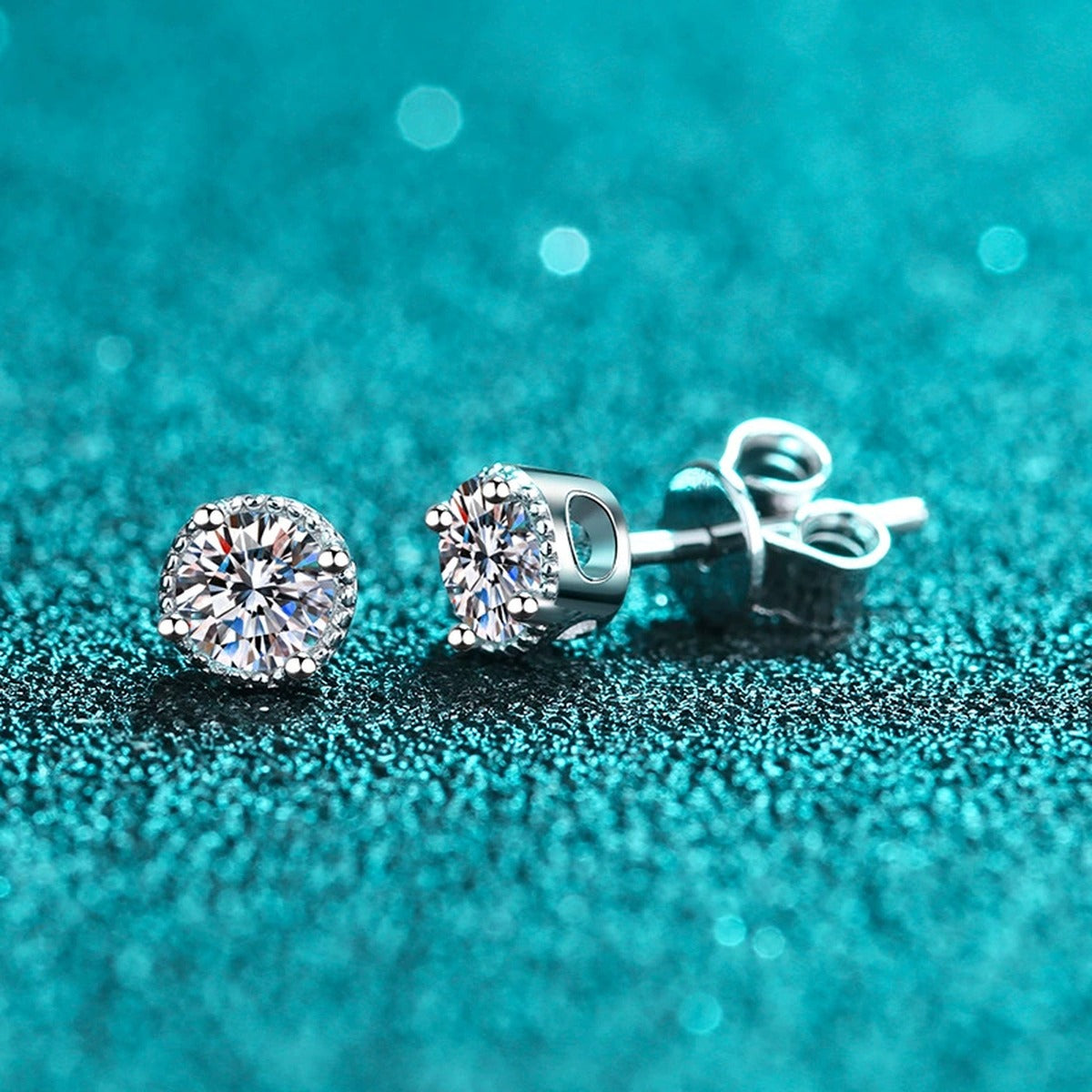 Round Moissanite Stud Earrings in Rhodium-Plated S925 Sterling Silver blue textured side view showing one front stud and one push-back post