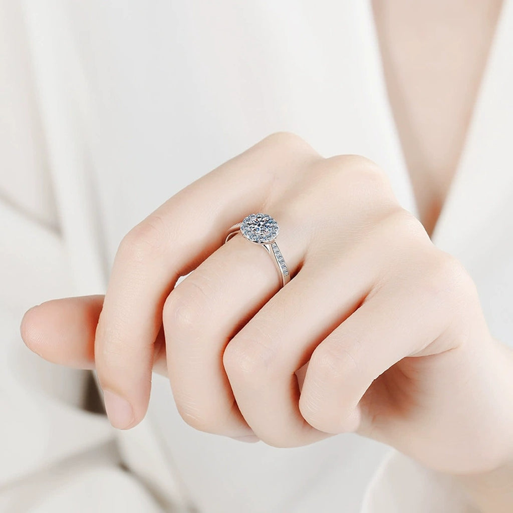 Round Halo Moissanite Ring with CZ in Rhodium-Plated S925 Sterling Silver worn on hand, showing scale, finger coverage, and rhodium-plated finish