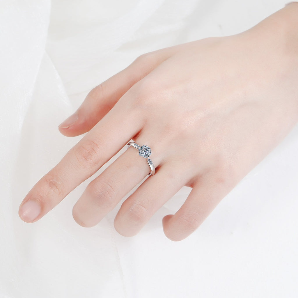 Round Cluster Moissanite Ring with CZ worn on hand to show scale, band width, and ring profile